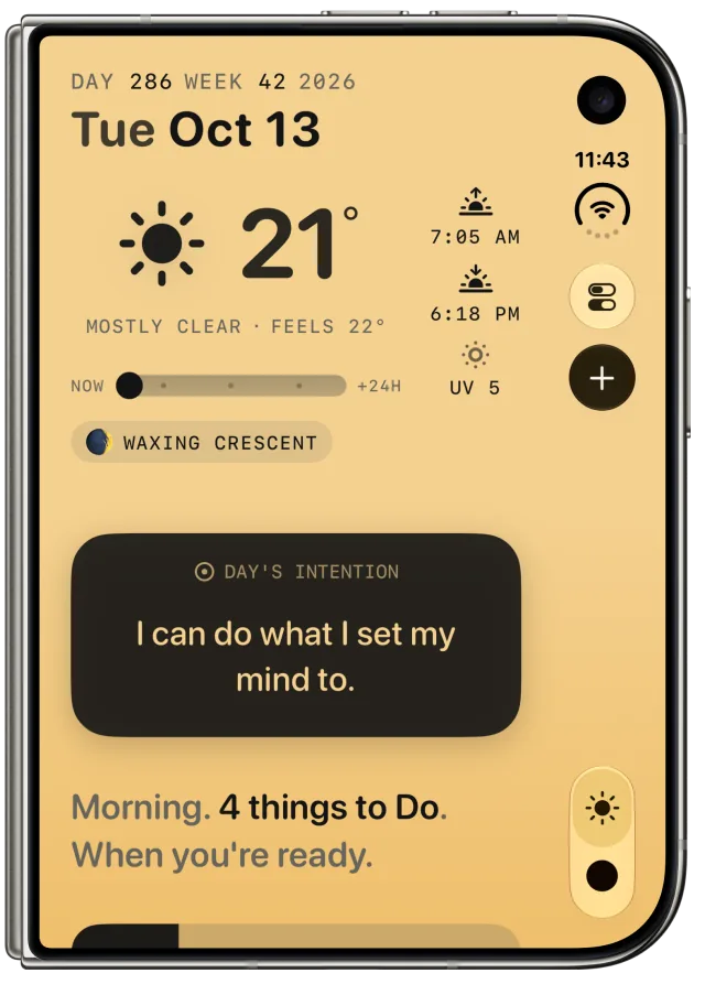 Solarday on the cover display of a closed iPhone Duo, held upright, in the N&ordm; 2 Pencil theme. The full Day view: Tuesday October 13, 21 degrees and mostly clear, sunrise 7:05 AM and sunset 6:18 PM, a waxing crescent moon, and the Intention: I can do what I set my mind to. Settings, the + button and the Day and Do switch sit in a slim column along the right edge.